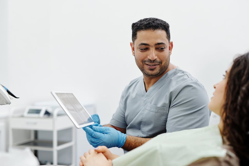 Cyber security for medical technology image of man holding a tablet computer