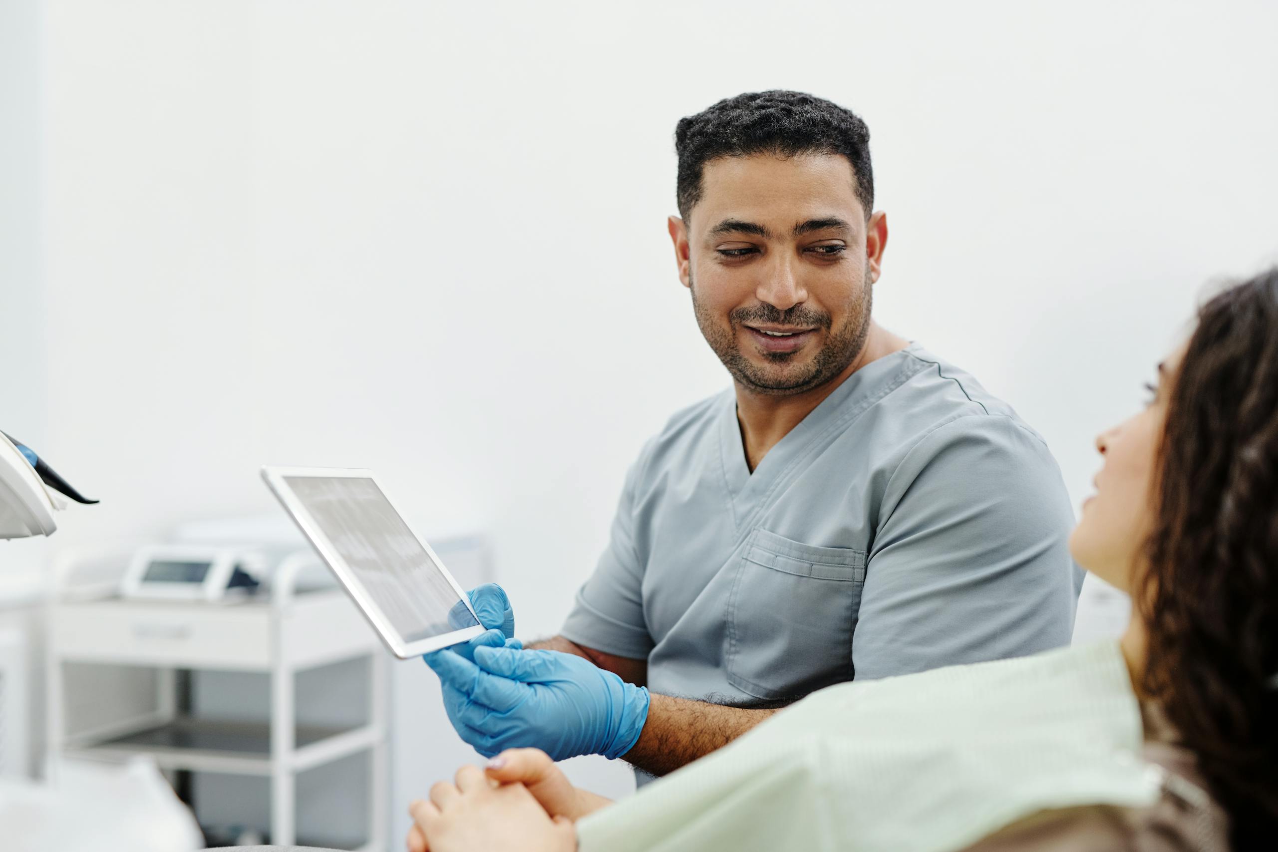 Cyber security for medical technology image of man holding a tablet computer