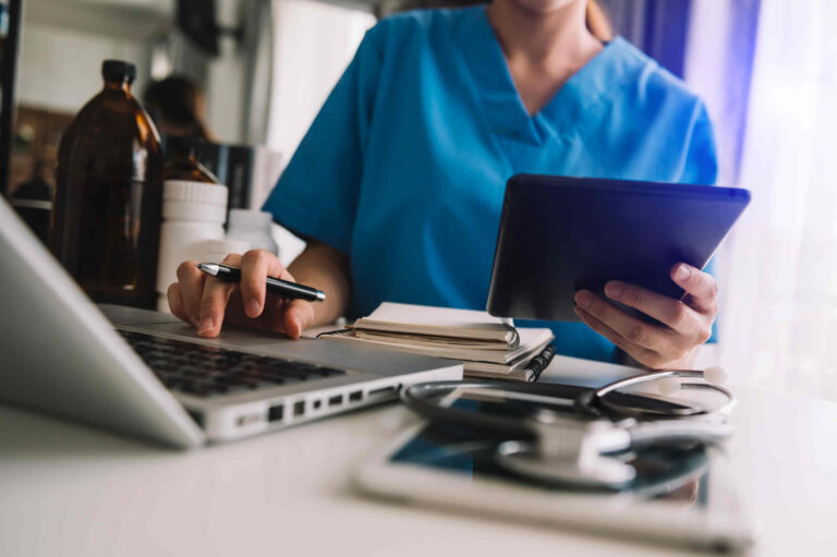 Medical professional undertaking med tech compliance paperwork